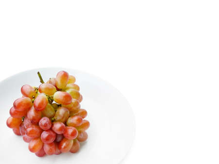 thai fruit - fresh grape in white dish on white backgroundの写真素材