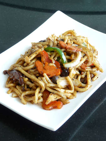 fusion chinese food - stir fried u dong with vegetables in black pepper sauceの写真素材