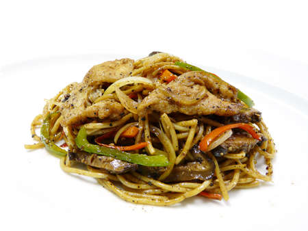 fusion food - stir fried egg noodles with pork and vegetables in black pepper sauceの写真素材