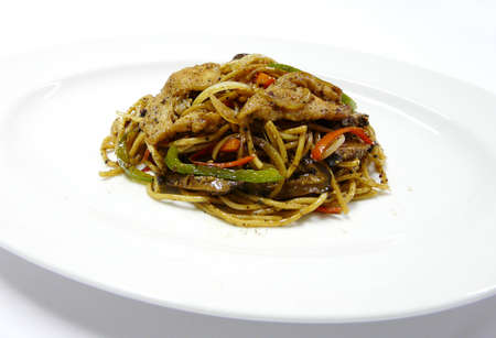fusion food - stir fried egg noodles with pork and vegetables in black pepper sauceの写真素材