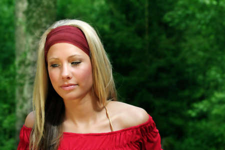 outdoor beauty portrait of a young smiling woman in natureの写真素材
