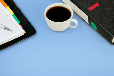 Cup of coffee on blue background