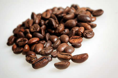 Stack roasted beans on grey backgroundの写真素材