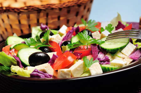 Plate with salad on blue backgroundの写真素材