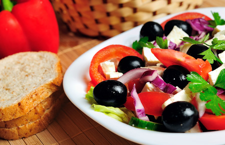 Plate with salad on tableの写真素材