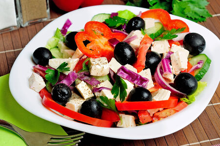 Plate with salad on tableの写真素材