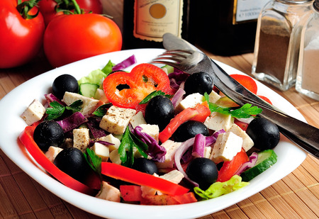 Plate with salad on tableの写真素材