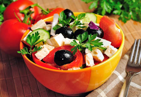Bowl with salad on tableの写真素材