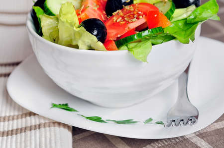 Bowl with salad on tableの写真素材