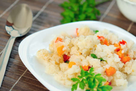 Plate with risotto and vegetableの写真素材