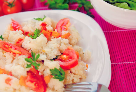 Plate with risotto and vegetableの写真素材