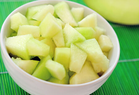 White bowl with melon salad の写真素材