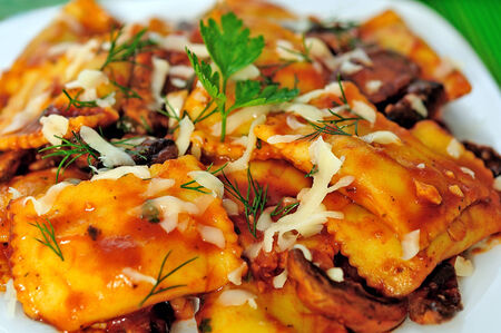 Plate with ravioli on tableの写真素材