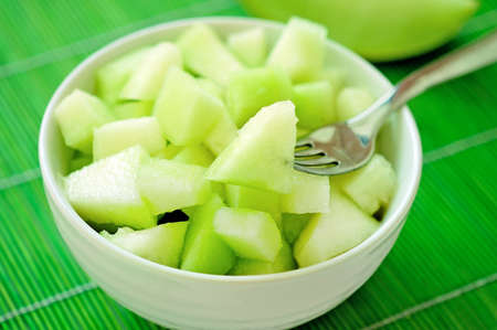 Bowl with melon salad on tableの写真素材