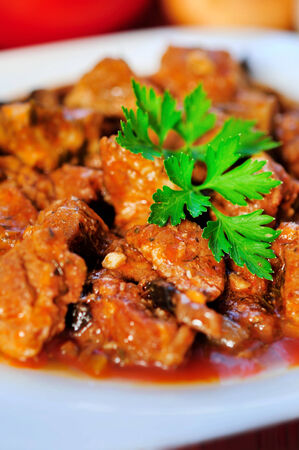 Plate with stew of pork meatの写真素材