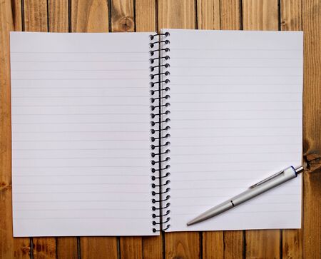 Empty notebook on wooden tableの写真素材