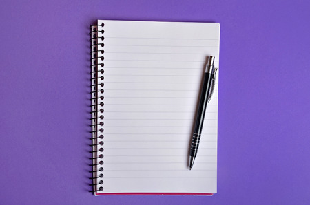 Empty notebook and pen on backgroundの写真素材