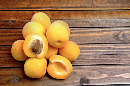 Apricots fruit on wooden tableの写真素材