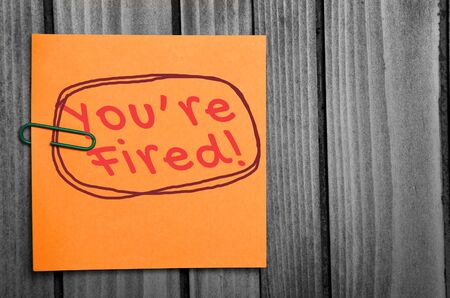 You are fired word on orange notesの写真素材