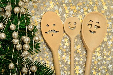 Family lovely wooden spoon with tree branchの写真素材
