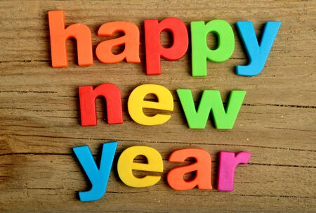 Happy New Year word on wooden tableの写真素材