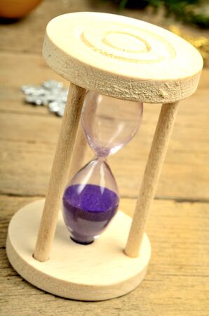 Glass time on wooden table