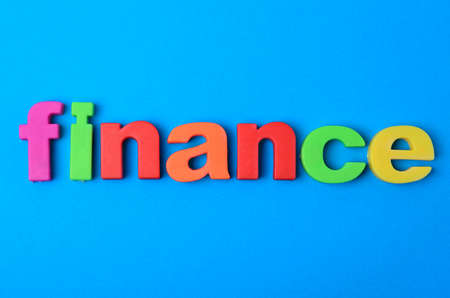 Finance word on blue backgroundの写真素材