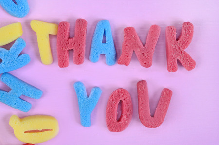 Thank You words on pink wooden tableの写真素材
