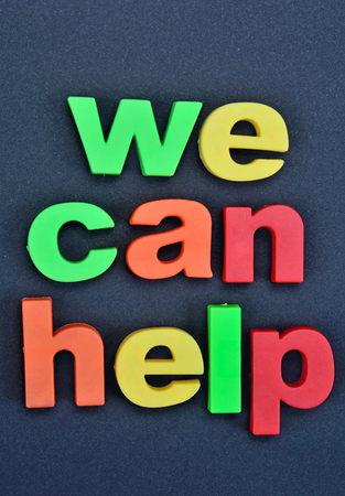 Words We can help on black backgroundの写真素材
