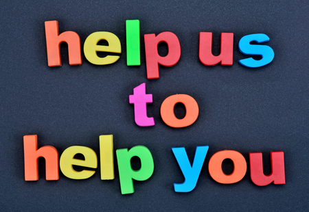 Text Help us to help you on black backgroundの写真素材
