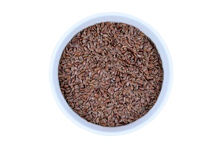 Isolated bowl with flaxseeds on white backgroundの写真素材