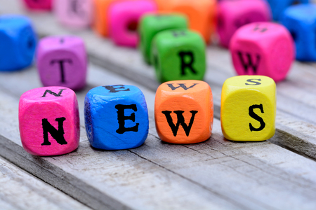 News word on wooden tableの写真素材