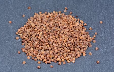 Group of brown buckwheat on slateの写真素材