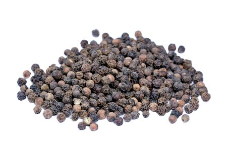 Isolated group of black peppercorns on white backgroundの写真素材