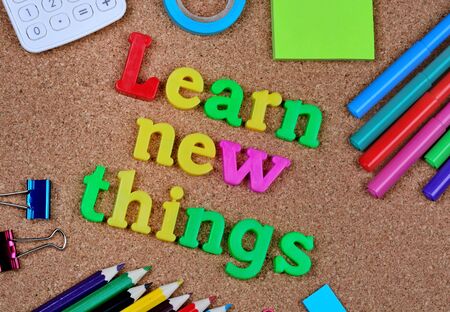 Learn new things words on cork backgroundの写真素材