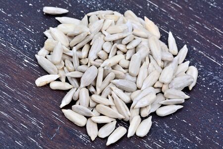 Group of sunflower seeds on wooden table