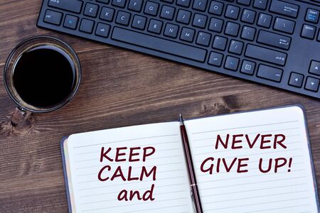 Text Keep  calm and never give up on notebook page