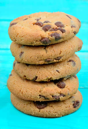 Delicious cookies on green wooden table
