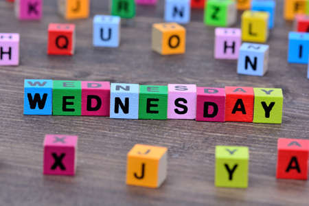 Wednesday word on wooden tableの写真素材