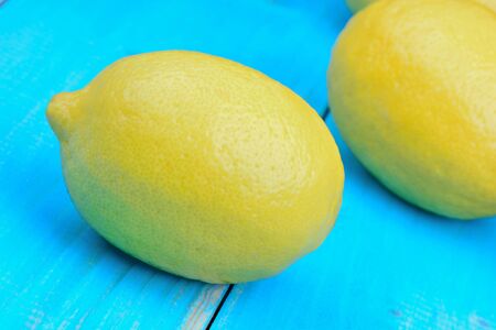 Lemons fruit on blue wooden table