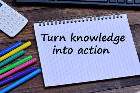 Turn knowledge into action words on notebook page