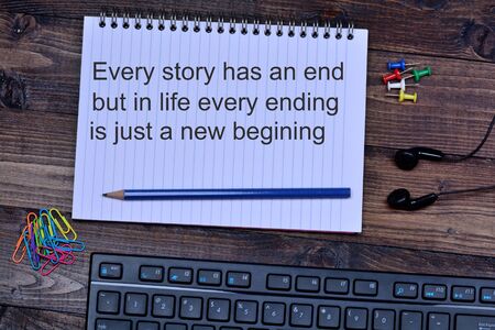 Every story has an end but in life every ending is just a new begining on notebookの写真素材