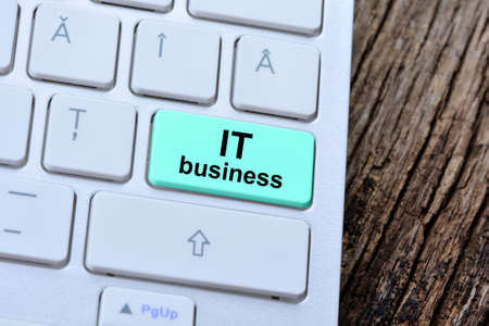It business words on computer keyboard button close-up