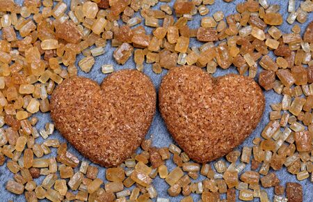 Sugar hearts with candy crystals on slate close-upの写真素材