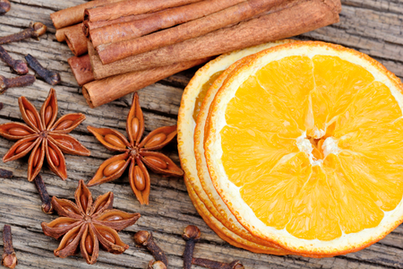 Slices of orange, cinnamon sticks, anise and cloves close-upの写真素材