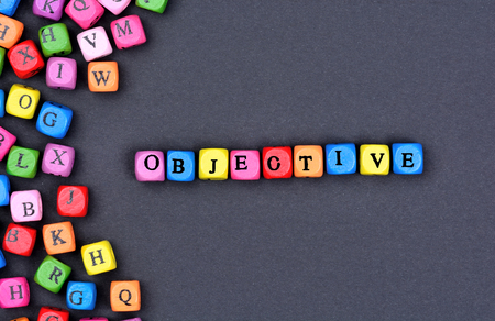 Objective word on black background close upの写真素材