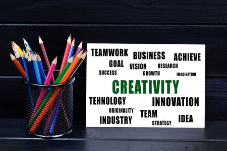 Creativity word on paper on a wooden tableの写真素材