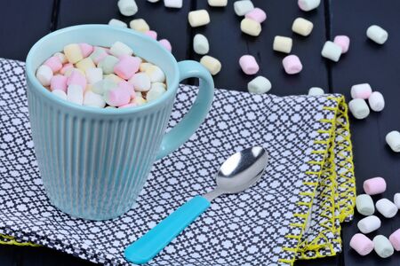 Hot chocolate with colorful marshmallows in a cupの写真素材
