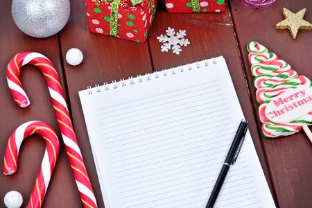 Empty notebook with christmas ornament ona wood tableの写真素材