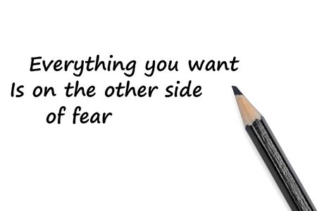 Everything you want is on the other side of fear text on white background close-upの写真素材
